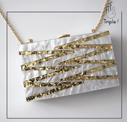 Pearl and gold clutch