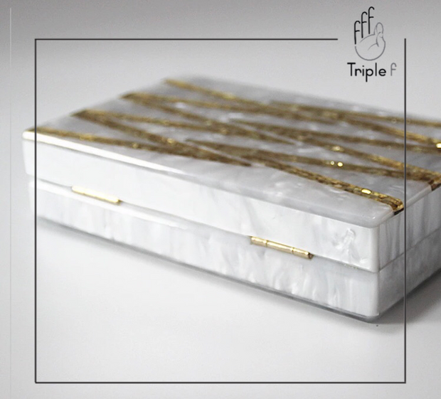 Pearl and gold clutch